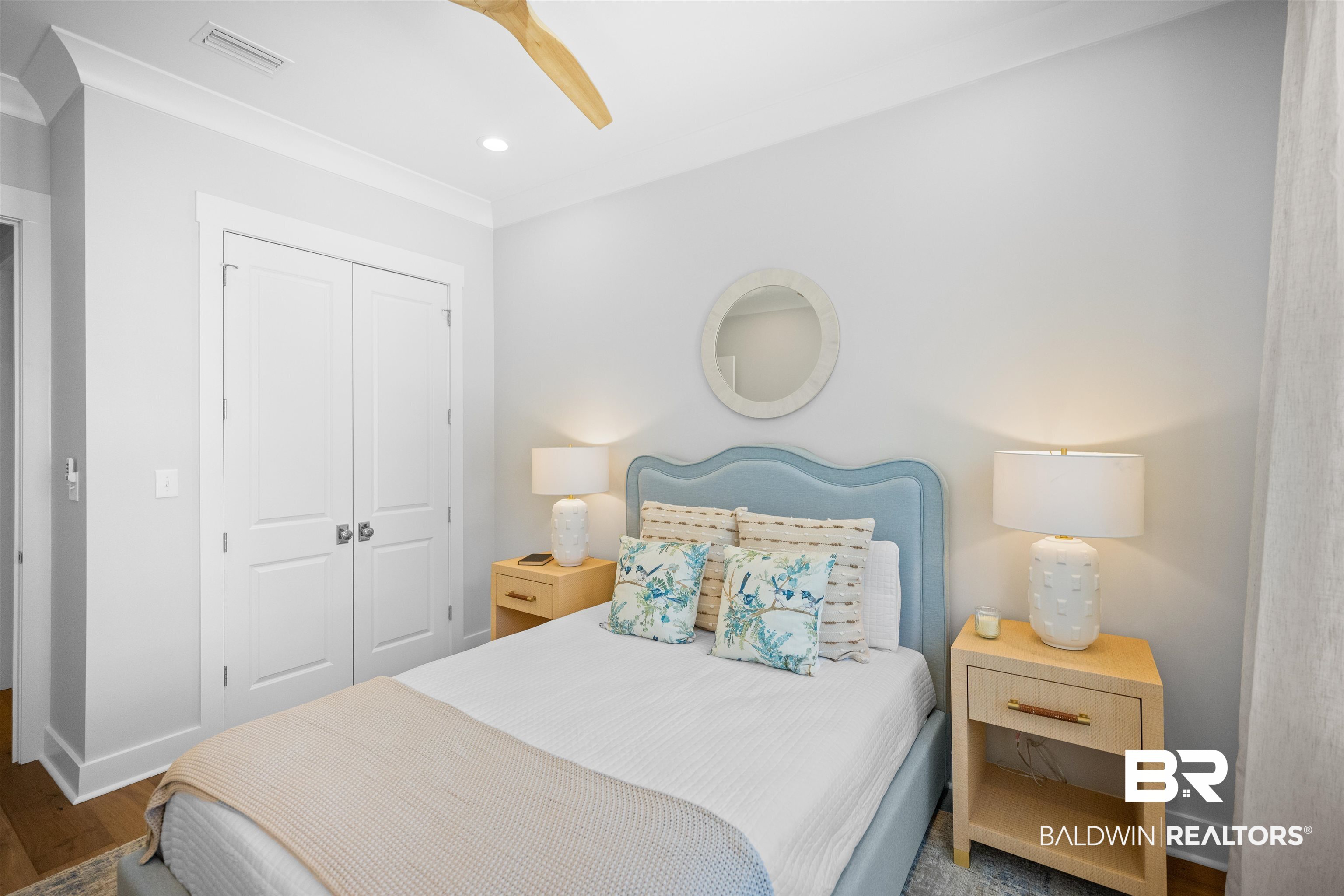 156 Hyacinth Street Fairhope, AL 36532 - Photo 46 of 61 Bedroom featuring a closet, ceiling fan, ornamental molding, wood finished floors, and recessed lighting