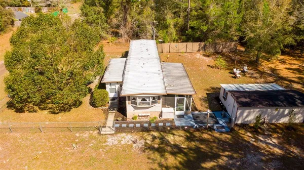 a kitchen with stainless steel appliances a refrigerator and a stove top oven