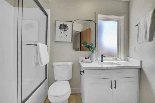 a living room with a sink furniture and a window