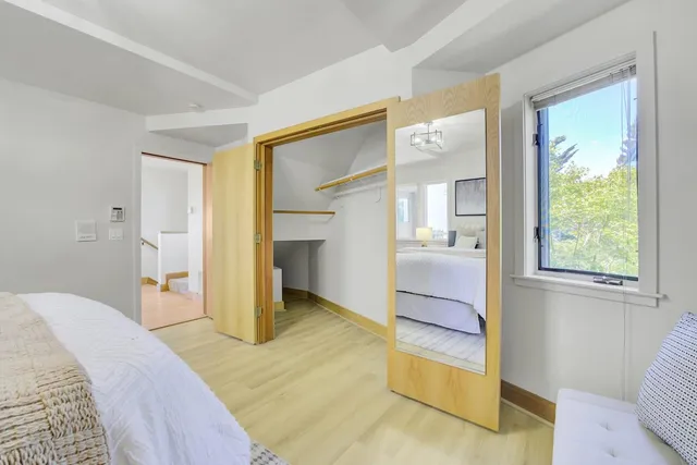 a living room with furniture and floor to ceiling window