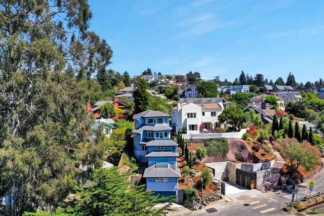 an aerial view of a house with yard swimming pool and outdoor seating