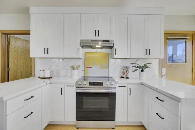 a dining room with furniture window and wooden floor