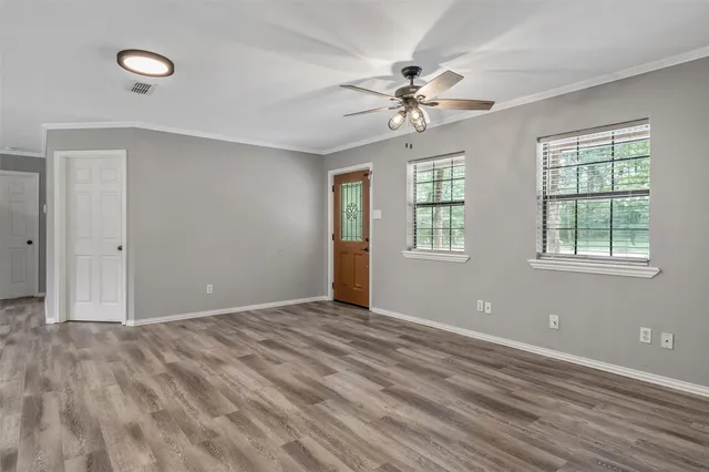 a view of an empty room with a window