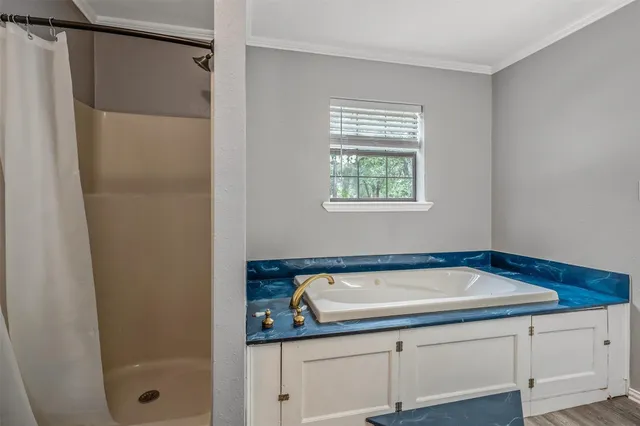 a bathroom with a sink and a shower