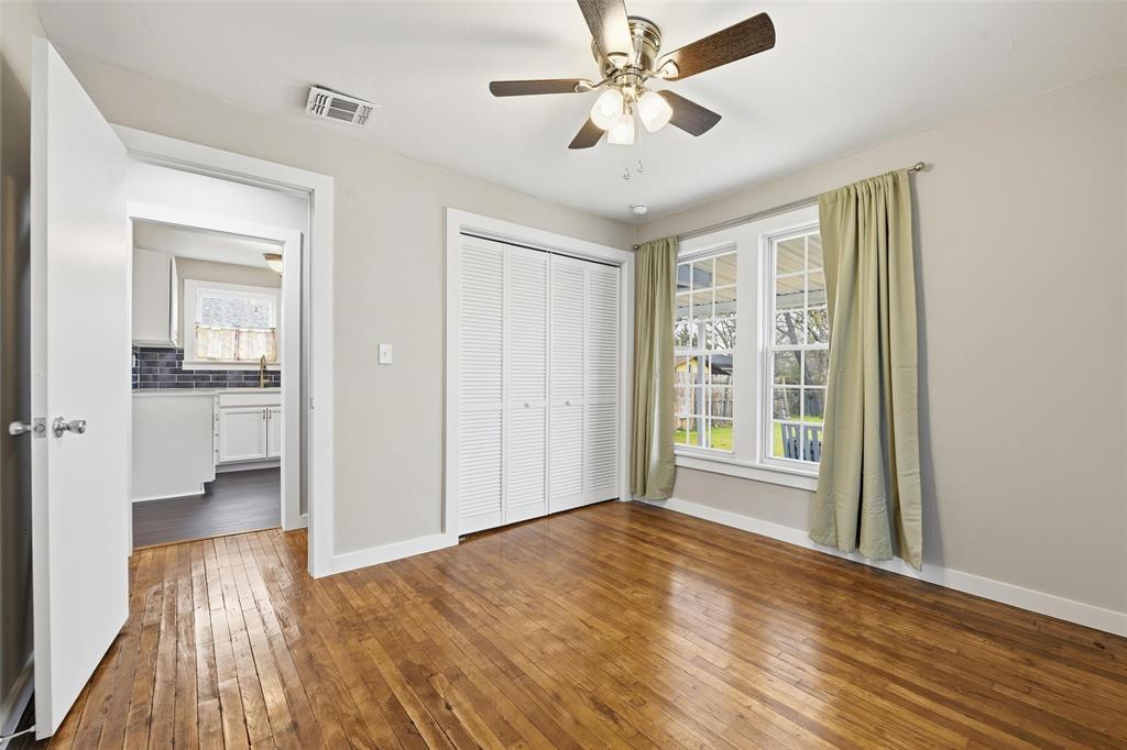 702 North Church Street Decatur, TX 76234 - Photo 11 of 36 wooden floor in an empty room with a window