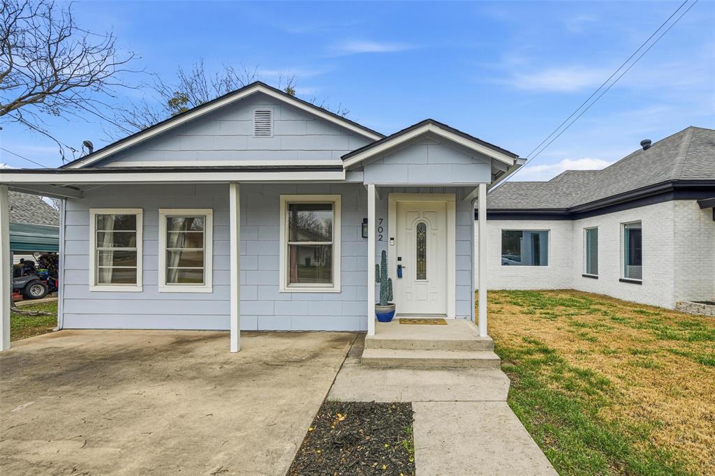 702 North Church Street Decatur, TX 76234 - Photo 3 of 36 a front view of a house with a yard