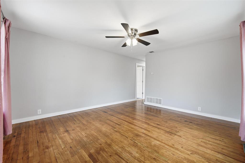 702 North Church Street Decatur, TX 76234 - Photo 7 of 36 wooden floor in an empty room