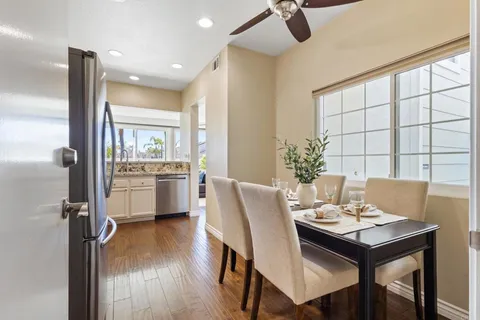 a view of a dining room with furniture and window