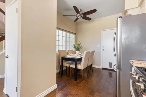 a dining room with furniture and window