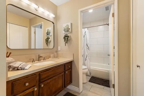 a bathroom with a shower and a toilet