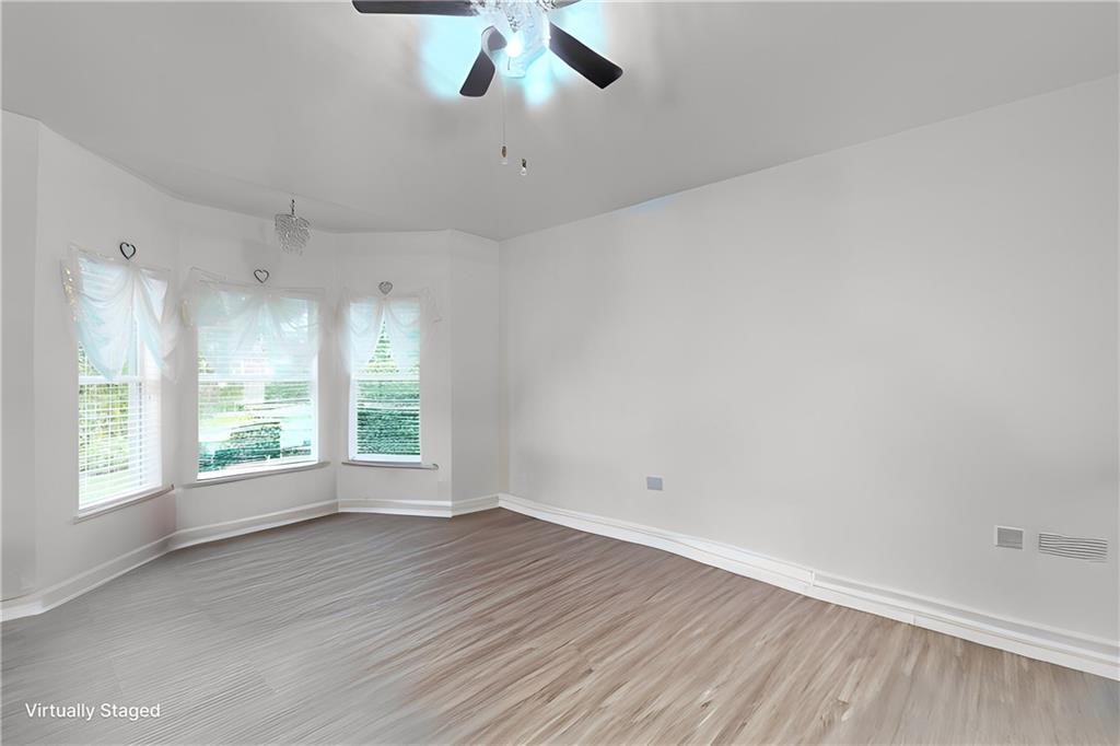 115 Briarcliff Circle Sebastian, FL 32958 - Photo 11 of 26 wooden floor in an empty room with a window