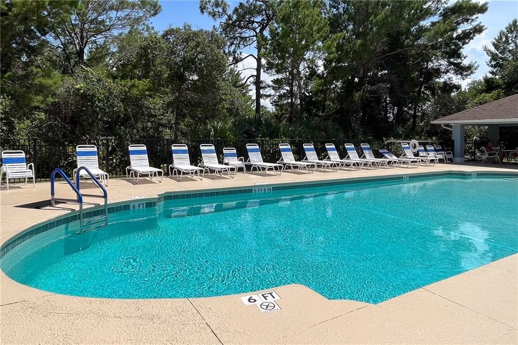 115 Briarcliff Circle Sebastian, FL 32958 - Photo 2 of 26 a view of a swimming pool with a patio