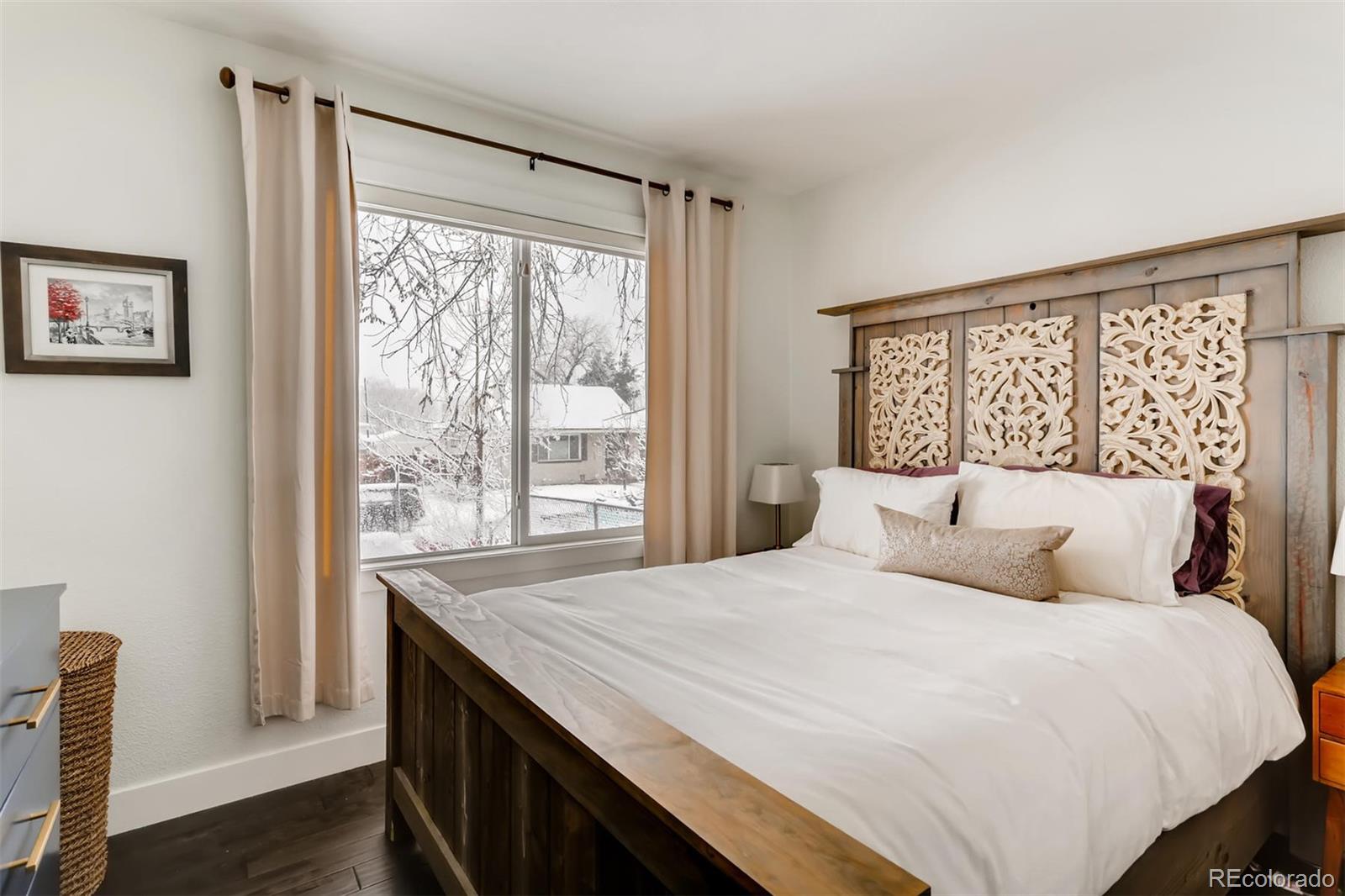 3510 Elizabeth Street Denver, CO 80205 - Photo 17 of 39 a bedroom with a large bed and a window