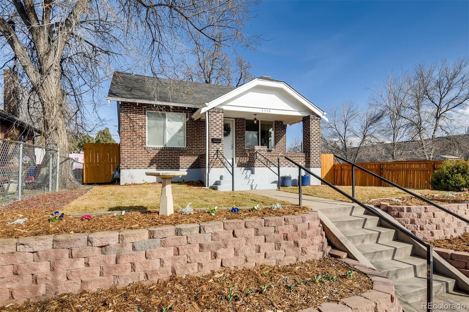 3510 Elizabeth Street Denver, CO 80205 - Photo 2 of 39 a view of a house with swimming pool
