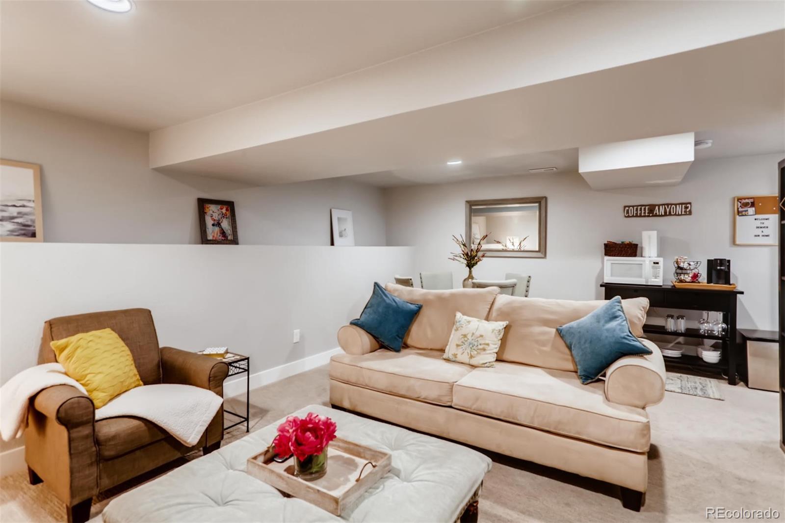 3510 Elizabeth Street Denver, CO 80205 - Photo 24 of 39 a living room with furniture and a couch