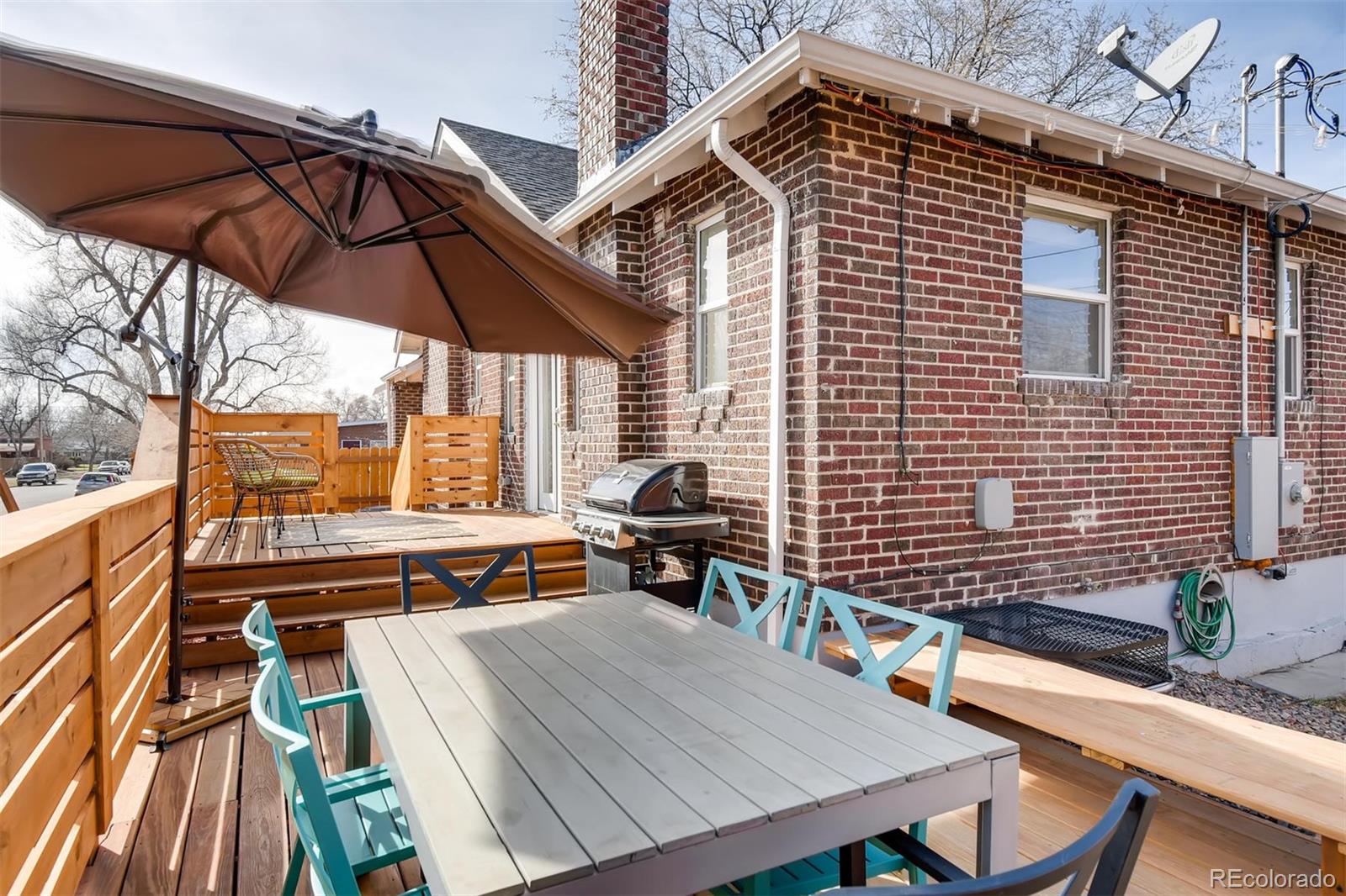 3510 Elizabeth Street Denver, CO 80205 - Photo 33 of 39 a view of a patio with a table and chairs under an umbrella