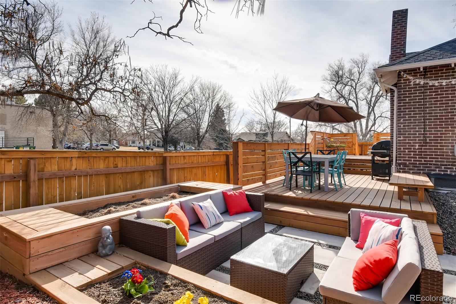 3510 Elizabeth Street Denver, CO 80205 - Photo 35 of 39 a roof deck with couches and potted plants