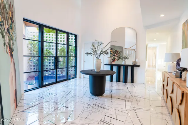 a dining room with table and chairs
