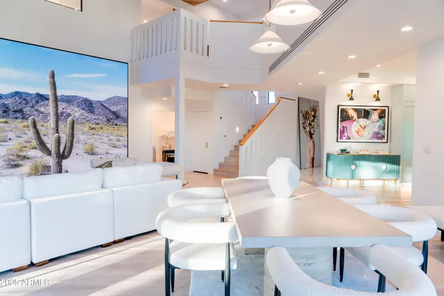 a kitchen with stainless steel appliances granite countertop a lot of counter space and wooden floors