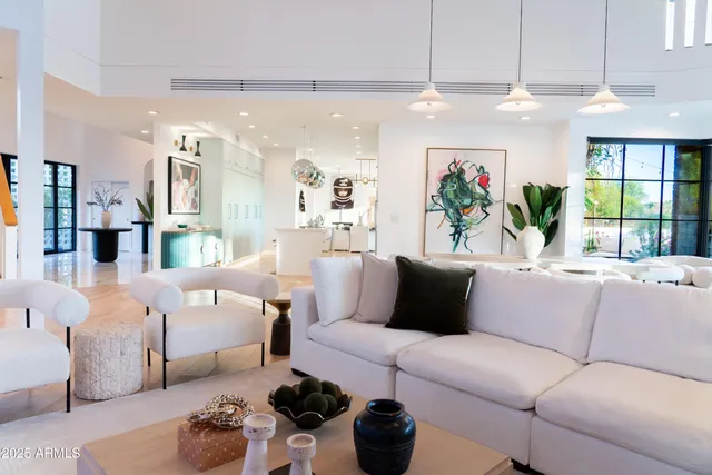 a large kitchen with a table and chairs