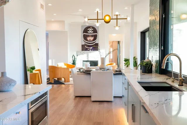 a living room with furniture and large windows