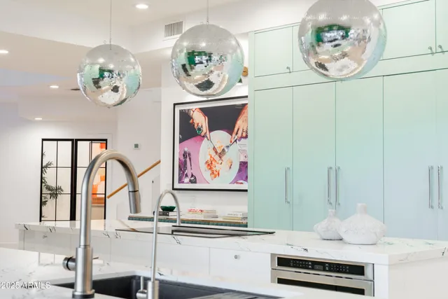 a view of living room with kitchen island furniture and floor to ceiling window