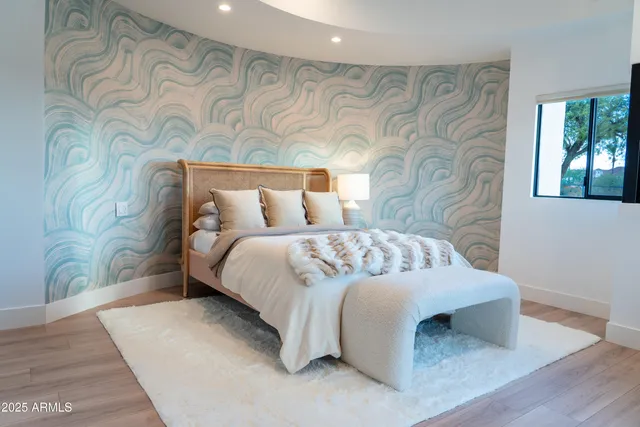 an aerial view of a house with a swimming pool