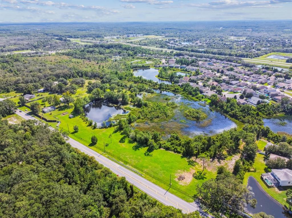 12321 Shady Hills Road Spring Hill, FL 34610 - Photo 14 of 30 a view of a lake with a city