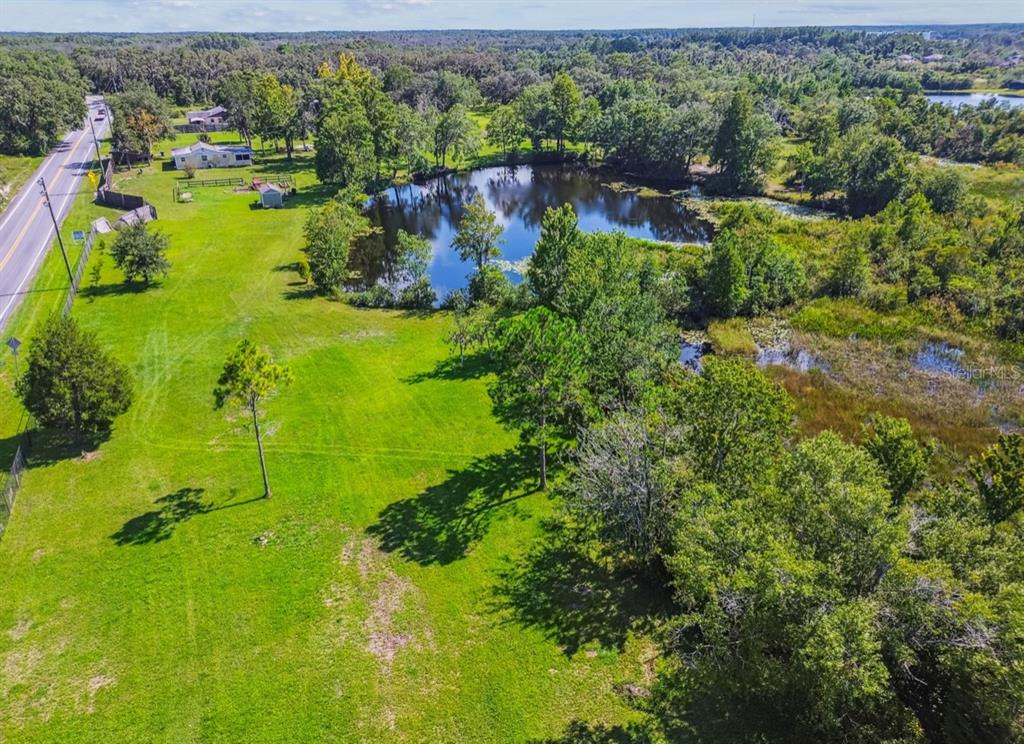 12321 Shady Hills Road Spring Hill, FL 34610 - Photo 20 of 30 an aerial view of residential houses with outdoor space and trees all around