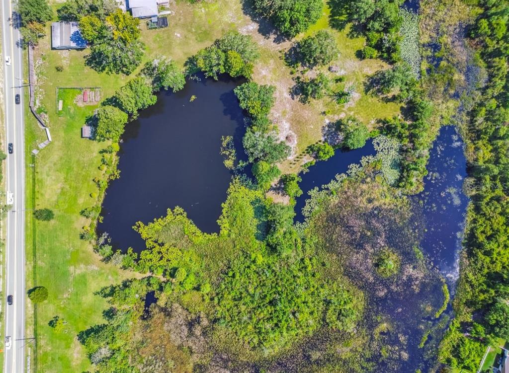 12321 Shady Hills Road Spring Hill, FL 34610 - Photo 29 of 30 an aerial view of a house with a yard