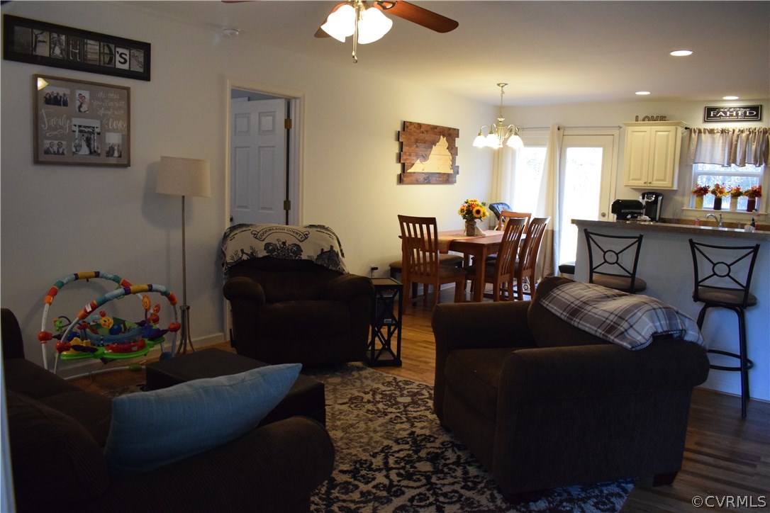 5185 Broad St Road Louisa, VA 23093 - Photo 4 of 24 a living room with furniture and a chandelier