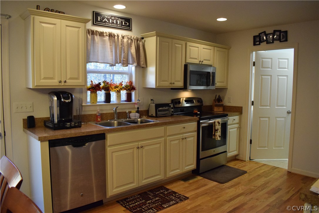 5185 Broad St Road Louisa, VA 23093 - Photo 7 of 24 a kitchen with a sink cabinets and wooden floor