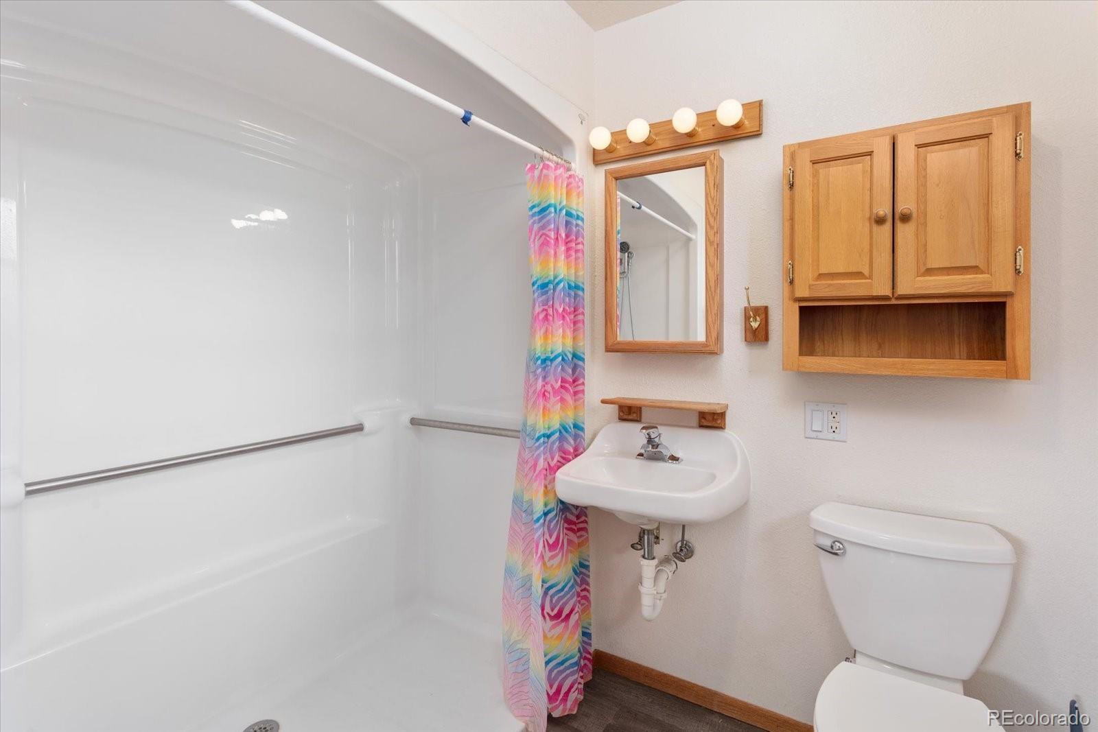 7401 County Road 141 Salida, CO 81201 - Photo 27 of 45 a bathroom with a sink toilet vanity and tub