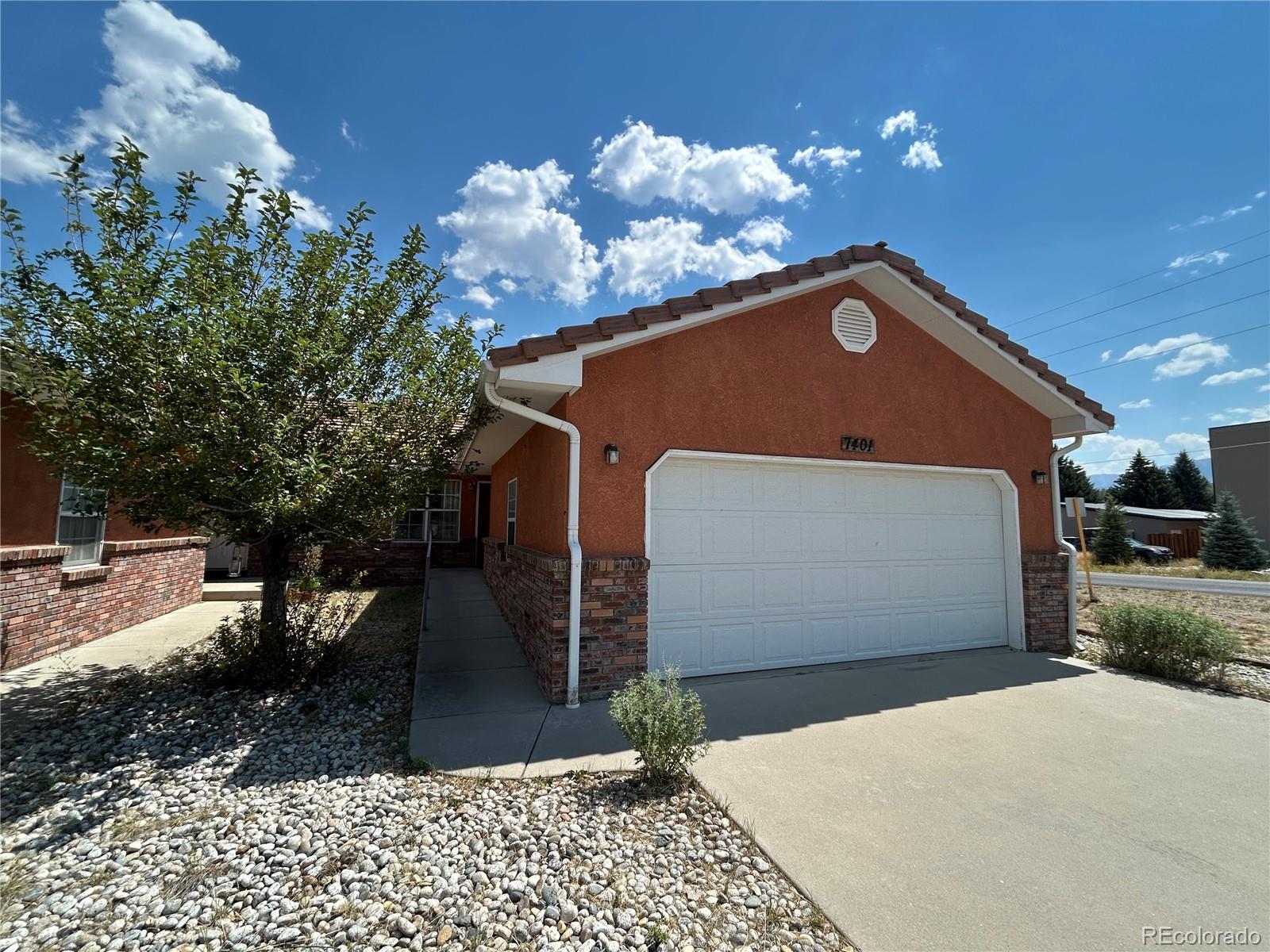 7401 County Road 141 Salida, CO 81201 - Photo 3 of 45 a front view of a house with garden