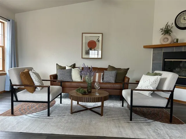 a kitchen with a table chairs sink and cabinets