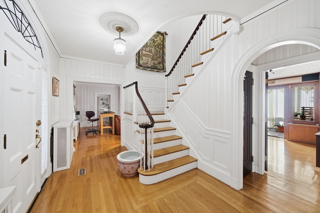 6 Elba Street Brookline, MA 02446 - Photo 12 of 34 a view of entryway and hall with wooden floor