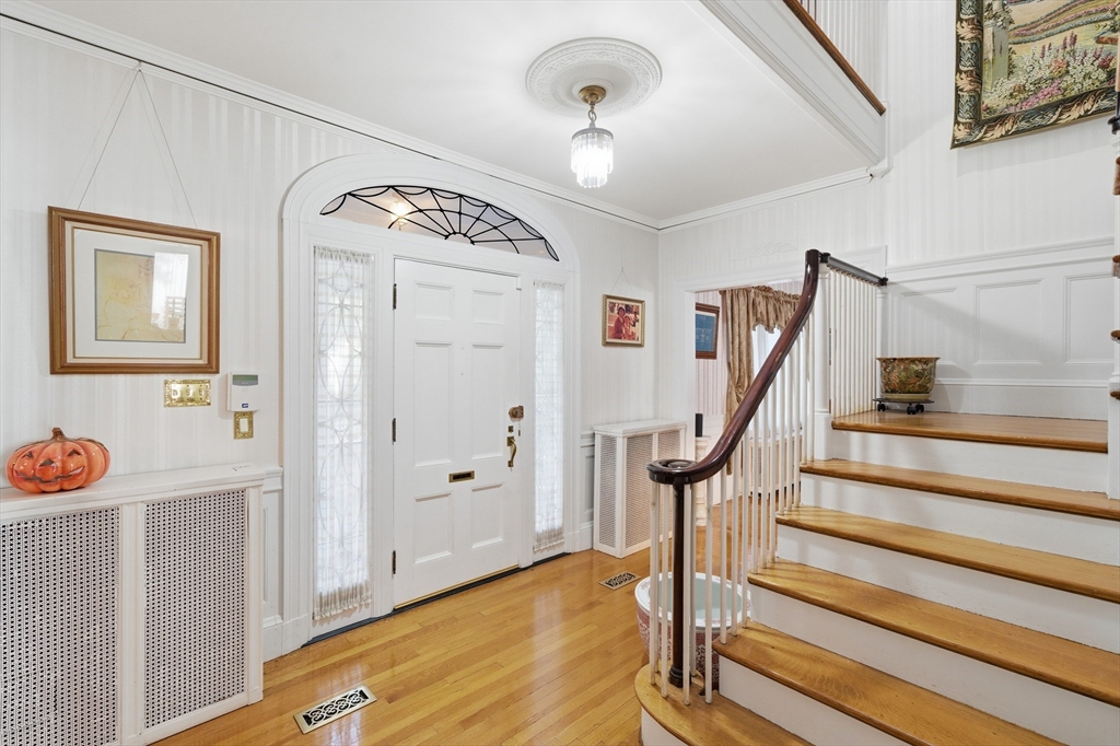 6 Elba Street Brookline, MA 02446 - Photo 13 of 34 a view of a hallway with wooden floor and staircase