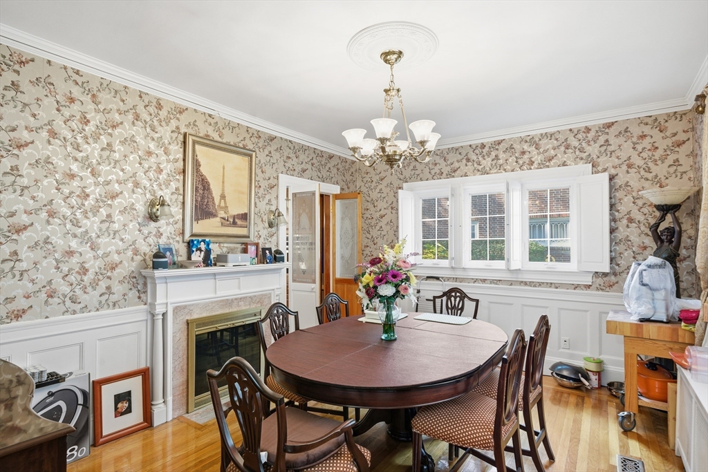 6 Elba Street Brookline, MA 02446 - Photo 14 of 34 a view of a dining room with furniture and a chandelier