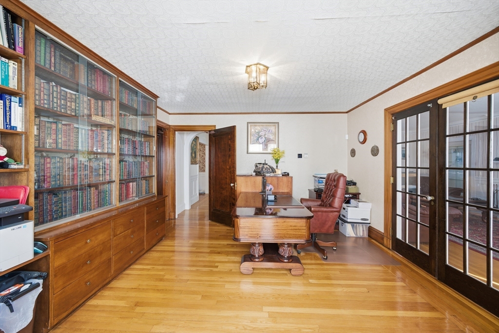 6 Elba Street Brookline, MA 02446 - Photo 16 of 34 a living room with furniture a rug and a window