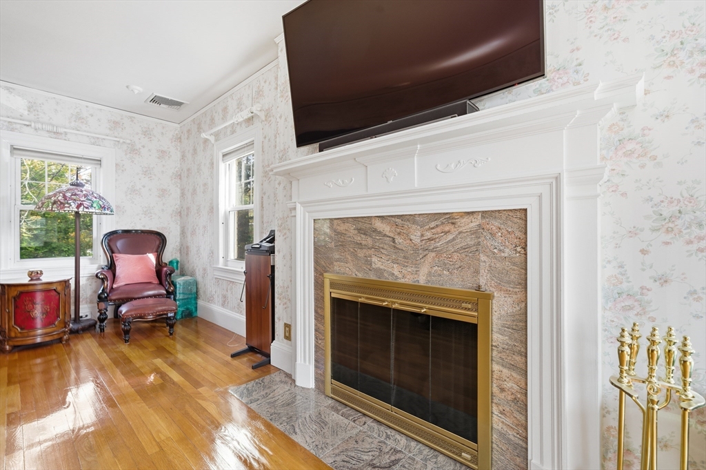6 Elba Street Brookline, MA 02446 - Photo 18 of 34 a living room with furniture and a fireplace