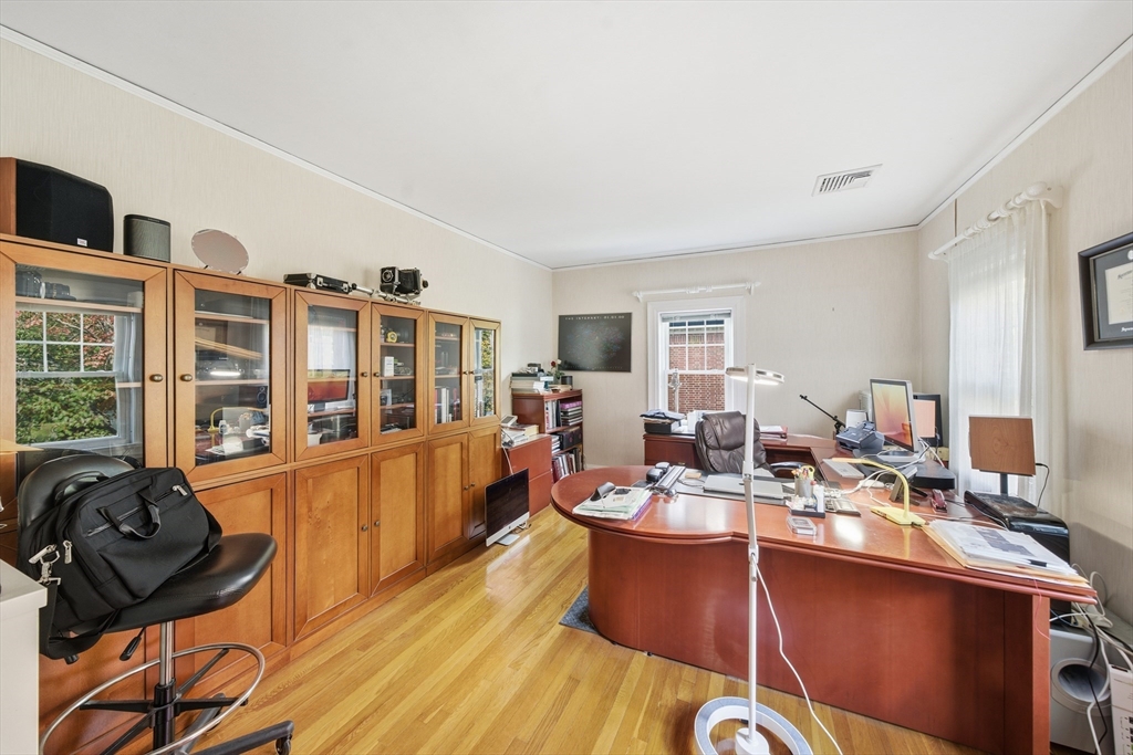 6 Elba Street Brookline, MA 02446 - Photo 21 of 34 a room with lots of furniture and windows