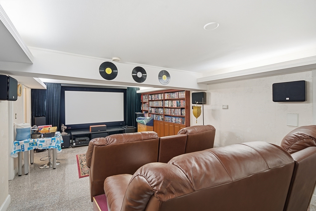 6 Elba Street Brookline, MA 02446 - Photo 33 of 34 a living room with furniture and a flat screen tv