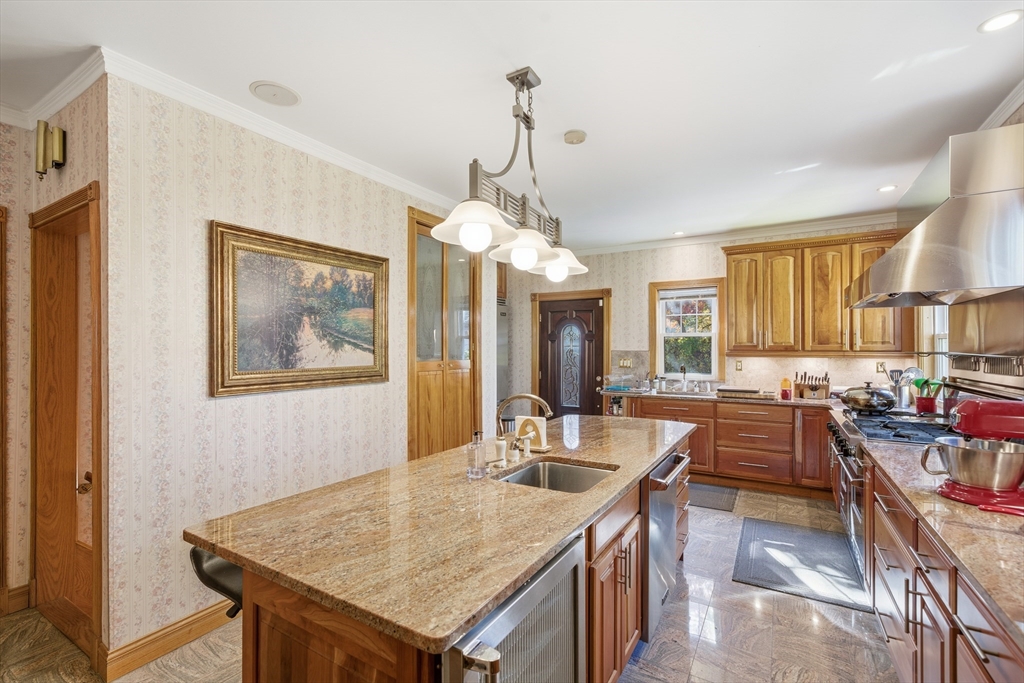 6 Elba Street Brookline, MA 02446 - Photo 8 of 34 a dining hall with stainless steel appliances granite countertop a granite counter tops and a view of living room