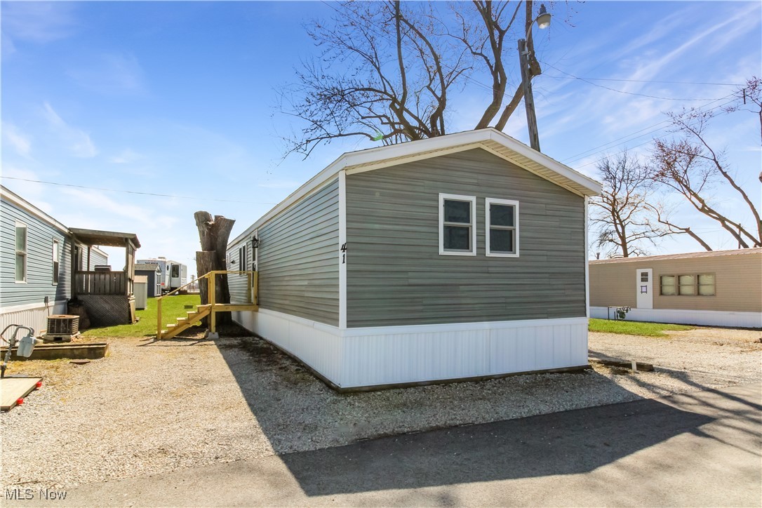 265 Meachem Road, Unit 41 Port Clinton, OH 43452 - Photo 30 of 33 View of property exterior featuring central AC unit