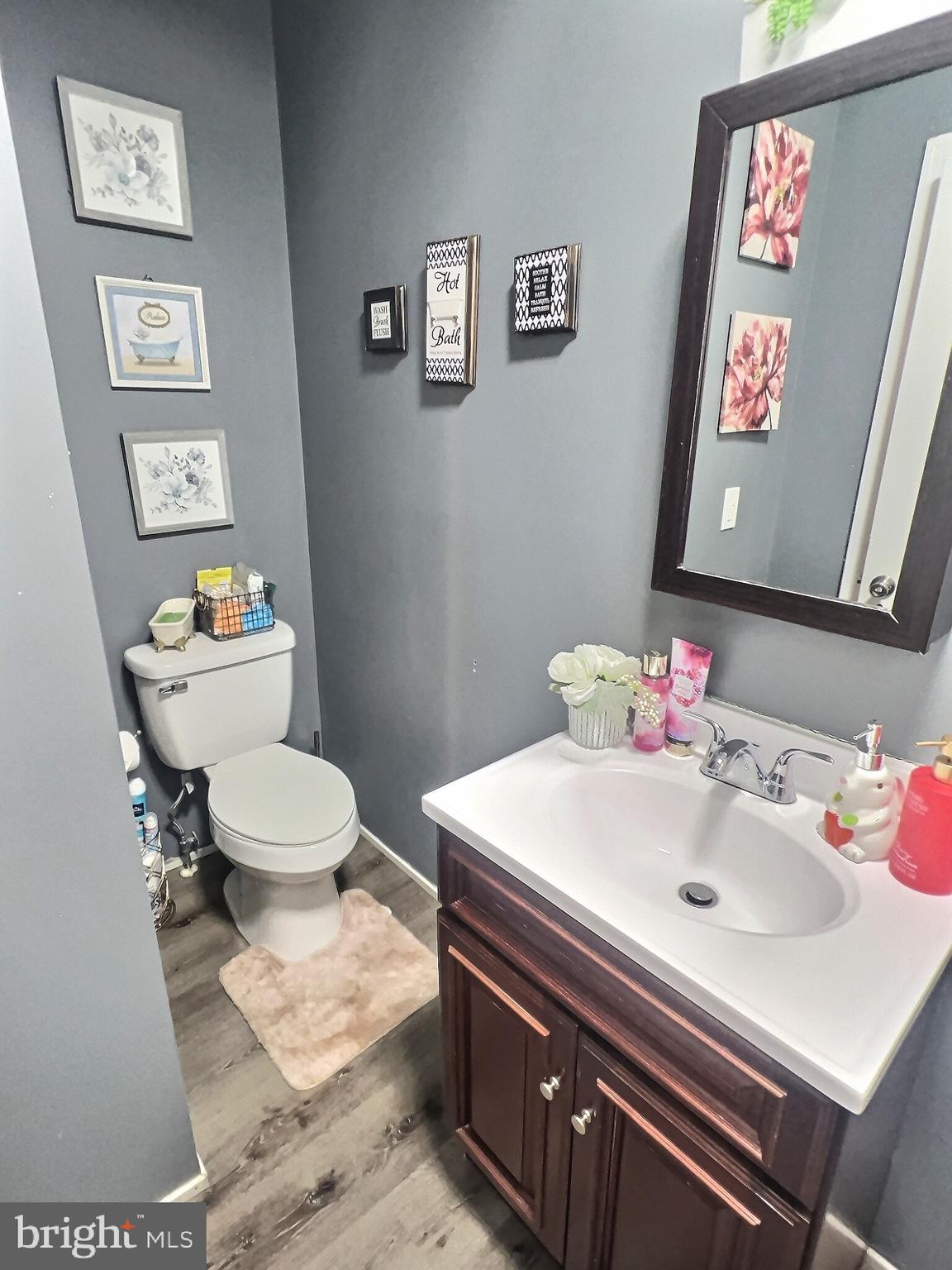 725 Pear Street Reading, PA 19601 - Photo 5 of 12 a bathroom with a sink mirror and toilet