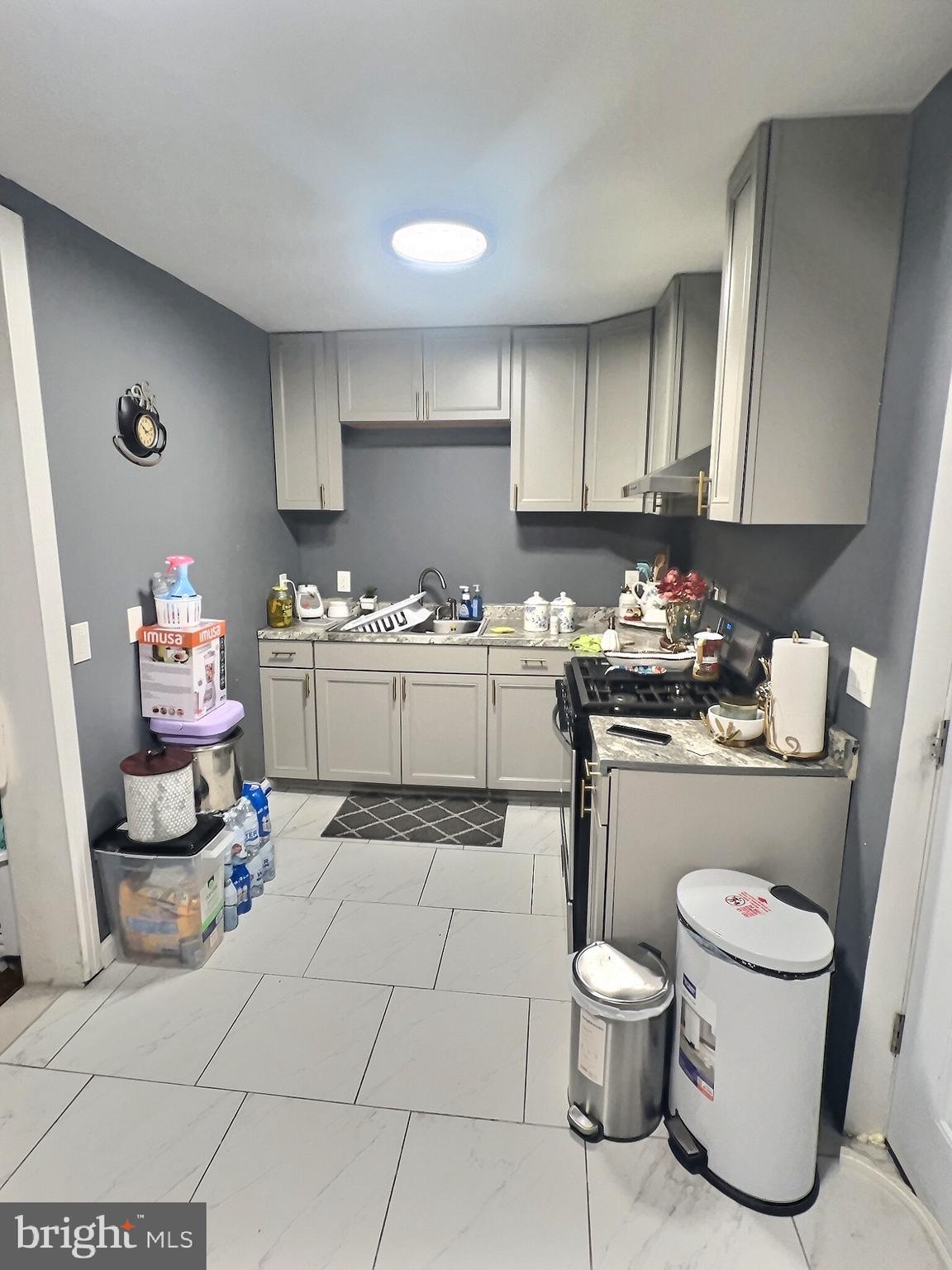 725 Pear Street Reading, PA 19601 - Photo 6 of 12 a kitchen with a sink and cabinets