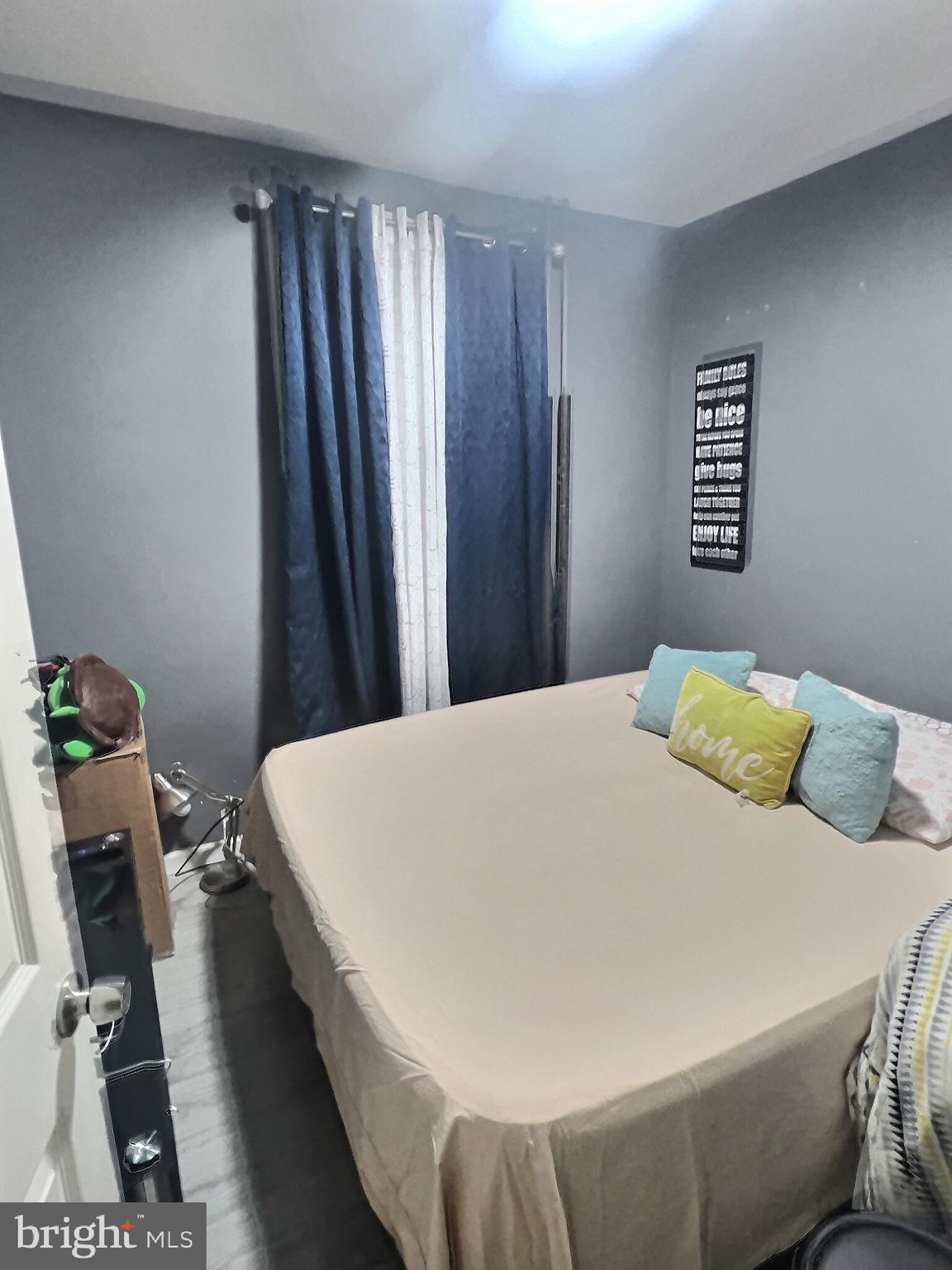 725 Pear Street Reading, PA 19601 - Photo 9 of 12 a bedroom with a bed and a table in it