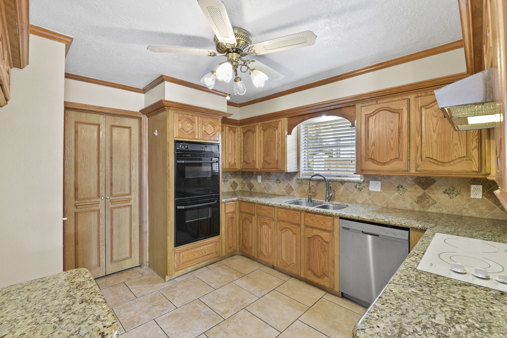 6507 Spring Leaf Drive Spring, TX 77379 - Photo 15 of 34 a bathroom with a granite countertop sink a mirror and cabinets