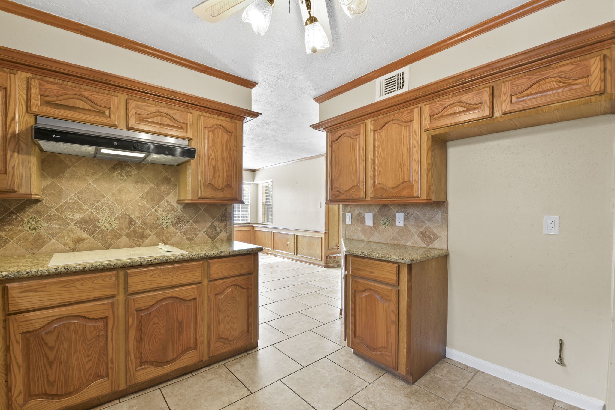 6507 Spring Leaf Drive Spring, TX 77379 - Photo 17 of 34 a kitchen with stainless steel appliances granite countertop a refrigerator and a stove