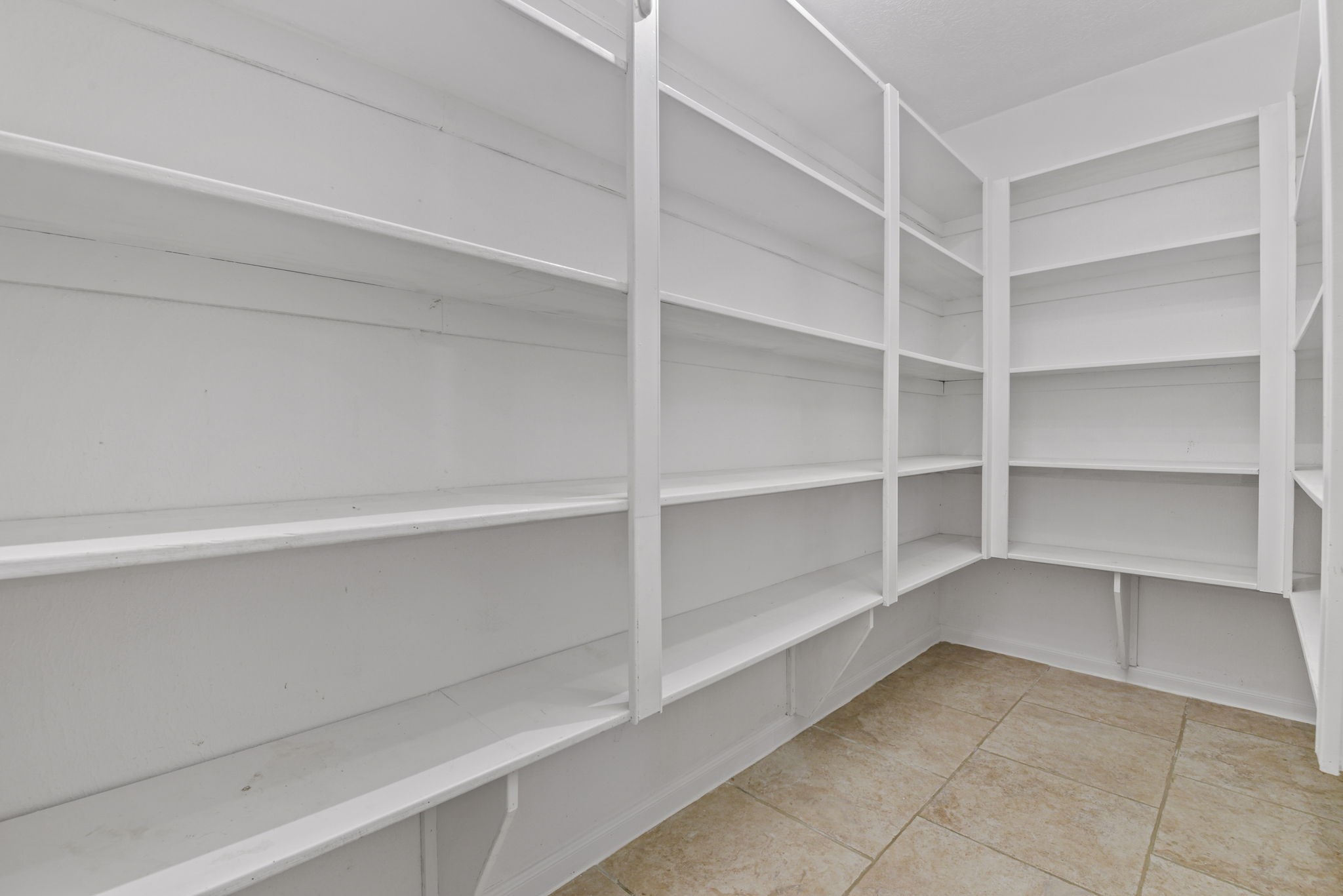 6507 Spring Leaf Drive Spring, TX 77379 - Photo 18 of 34 a view of walk in closet with empty racks
